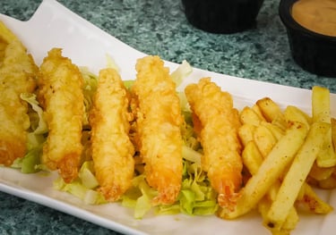 a plate of fried fried chicken nuggies and fries