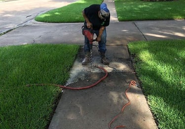 a man in a helmet is using a power drill