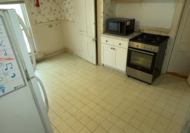 Junk removal truck loaded with appliances ready for disposal