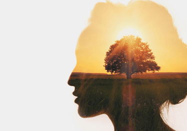 a woman's profile with a tree in the background