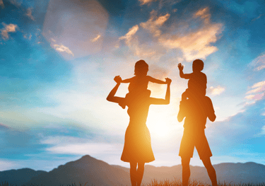 a man and woman holding hands up to the sky