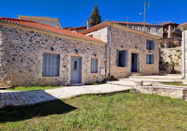 a stone building with a stone wall and a stone wall