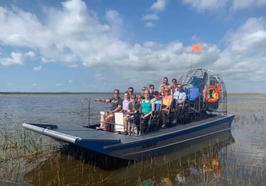 a group of people on an air boat in Florida lake