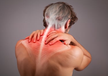 Man holding upper back showing neck and shoulder muscles, indicating muscle tightness / tension.