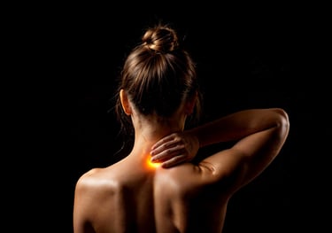 Glowing back of neck with woman touching the area indicating neck pain.