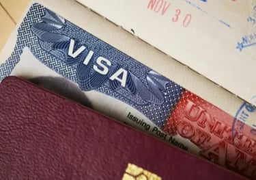 Close-up of a United States travel visa stamp inside a passport with official entry dates.