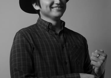 a man in a hat and a hat on a gray background