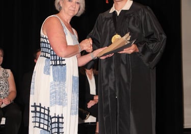 Young man in a graduation cap and gown