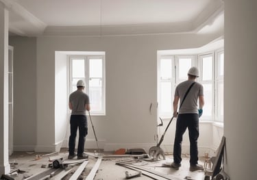 A building under renovation with extensive scaffolding surrounding its façade. The structure features classical architectural elements like ornate balconies and mansard roofs. Traffic barriers are placed at the base, indicating an active construction zone.