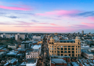 A drone image looking south down Chapel Street Precinct at sunrise