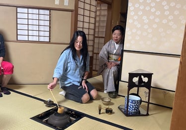Foreign guests making matcha during a tea ceremony experience in Nagasaki