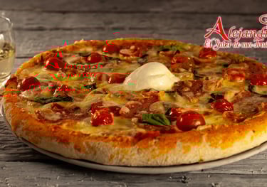 a pizza with cheese and tomatoes on a plate