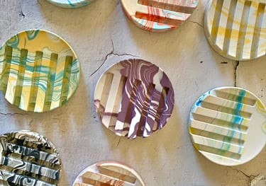 round jesmonite soap dishes in variety of colours and marbling effect