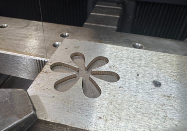 a metal object with a flower on it