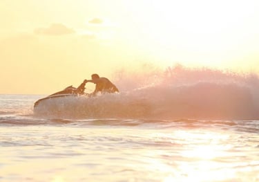 Jetski turning in evening sunlight in the ocean