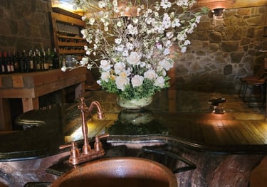 a rustic copper sink with a rustic copper sink