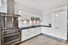 a kitchen with a stove top oven and a stove top oven
