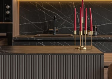 a kitchen with a table and chairs and candles