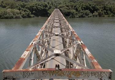 a train bridge with graffiti on it