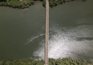 a bridge spanning a river with a bridge in the middle