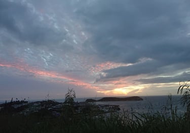 a sunset over a body of water