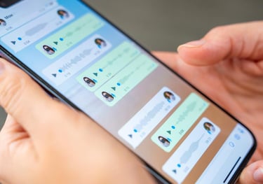 a person holding a phone, a language lesson WhatsApp Chat can be seen on the screen