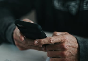 Photo of hands holding a phone