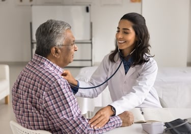 a doctor examining a patient's heartbeat