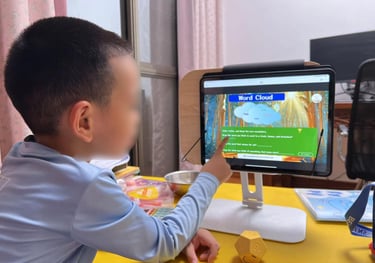 a young boy playing a video game on a computer