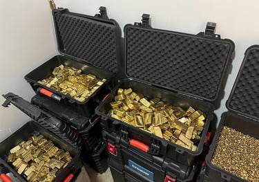 Assortment of raw gold nuggets and refined gold bars for sale