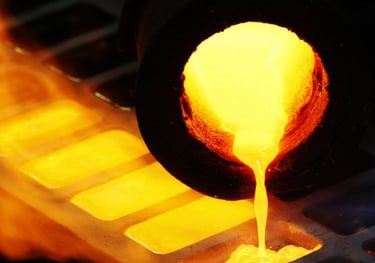 Molten gold being poured into molds for refining