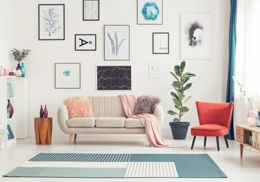 a living room with a couch and a rug