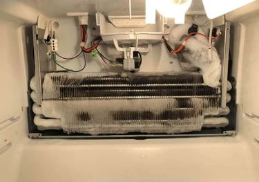 a fridge evaporator covered with ice that showing defrost issue