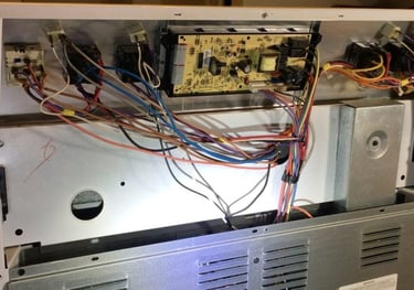 back panel of a range is removed for diagnostic and repair