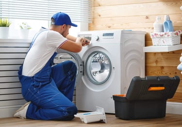 a person removing the front panel of a front load washer