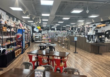 a store with tables and chairs and a wooden table