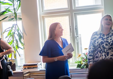Stephanie Garey hosting and presenting at a networking event and dinner 
