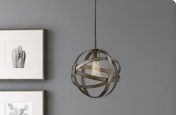 a modern light fixture hanging in a room
