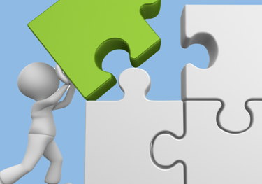a person is holding a piece of puzzle