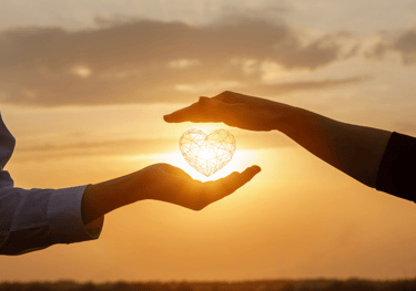 a person holding a heart shaped object in their hands