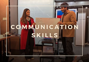 Corporate training - captain Zaira standing in front of a white board with a participant