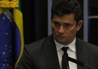 a man in a suit and tie is standing at a podium