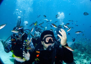 scuba diver students enjoying the variety of fishes in Lapu-lapu