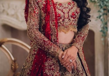 a bride in a red and gold bridalle wedding dress