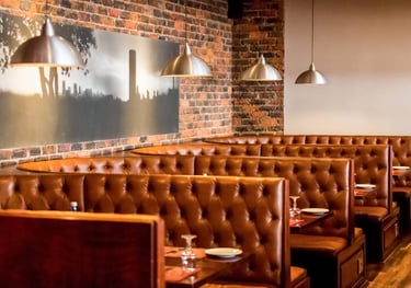 restaurant interior with brown leather booths 