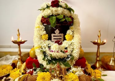 Sacred puja setup with kalash, flowers, and diya