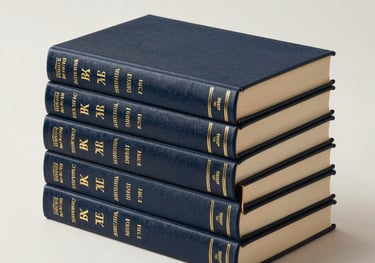 A professional studio photograph of a stack of elegant hardcover non-fiction books. The covers have gold foil lettering. Clean, bright off-white background with professional lighting.