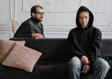 a man and woman sitting on a couch