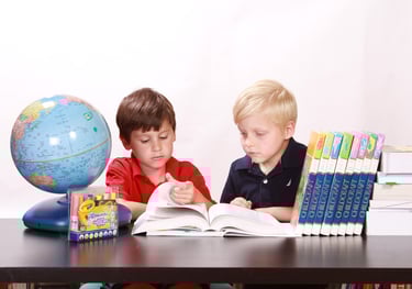 RESP Account; two kids sitting at a table with books and education fund