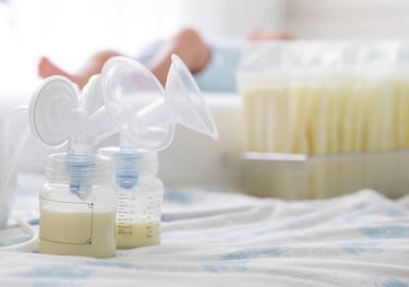 a baby bottle with a bottle of milk and a bottle of milk